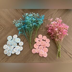 Baby shower accessories/ pins and floral arrangements.